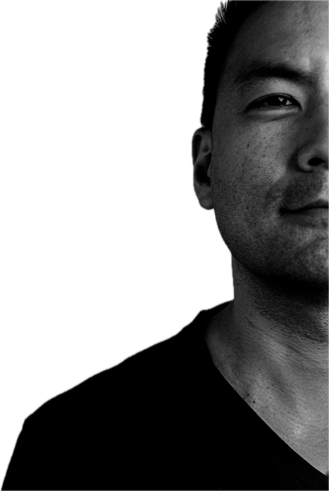Dean Moon, half in shadow, in a black T-shirt